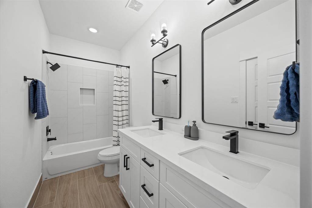 Jack & Jill bathroom connecting the secondary bedrooms.