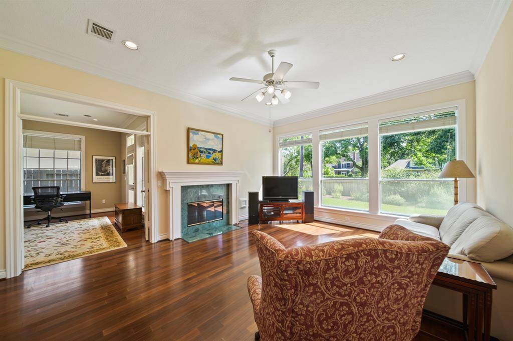 The Family Room Features a Gas Fireplace and an Abundance on Natural Lighting