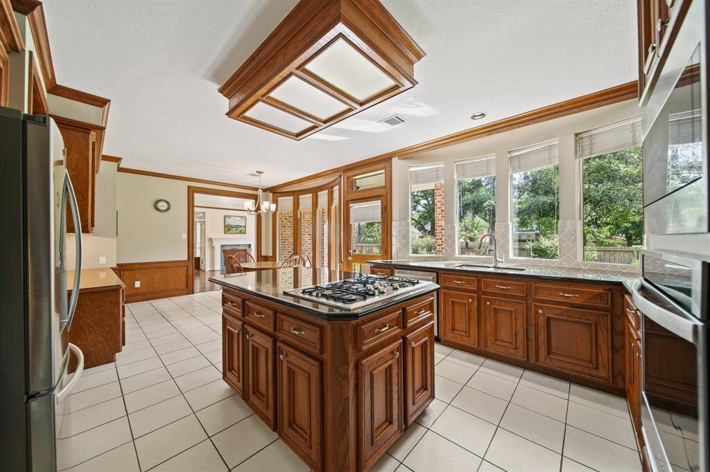 The Spacious Kitchen with Stainless Steel Appliances Including 5 Burner Gas Cooktop and Lots of Counter space.