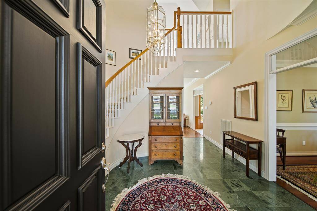 Inside Where You will be Greeted with Soaring 2-Story Coffered Ceiling