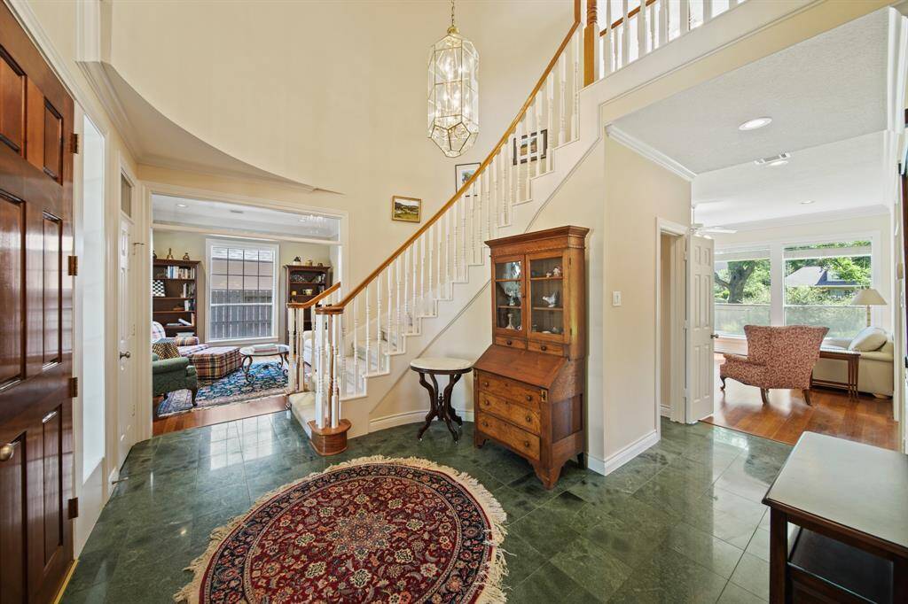 Left of the Entry you have a Room that is perfect for a Library, Sitting Room or Study. Transom Windows over the Doorways in the Living Areas Add an Elegant Touch.