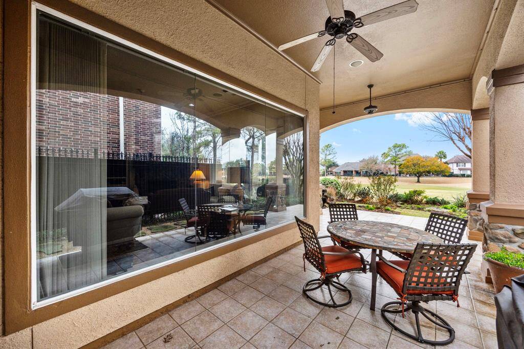 Just outside the breakfast area is the door to the spacious back patio overlooking the 5th fairway.