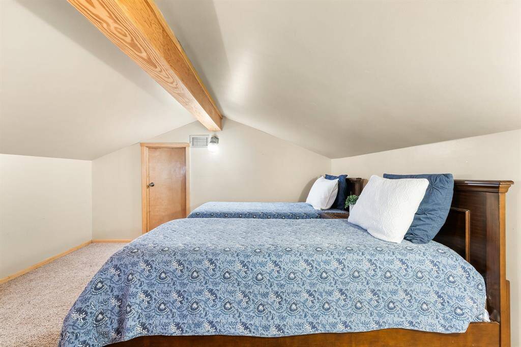 Loft with room for twin beds and play area.