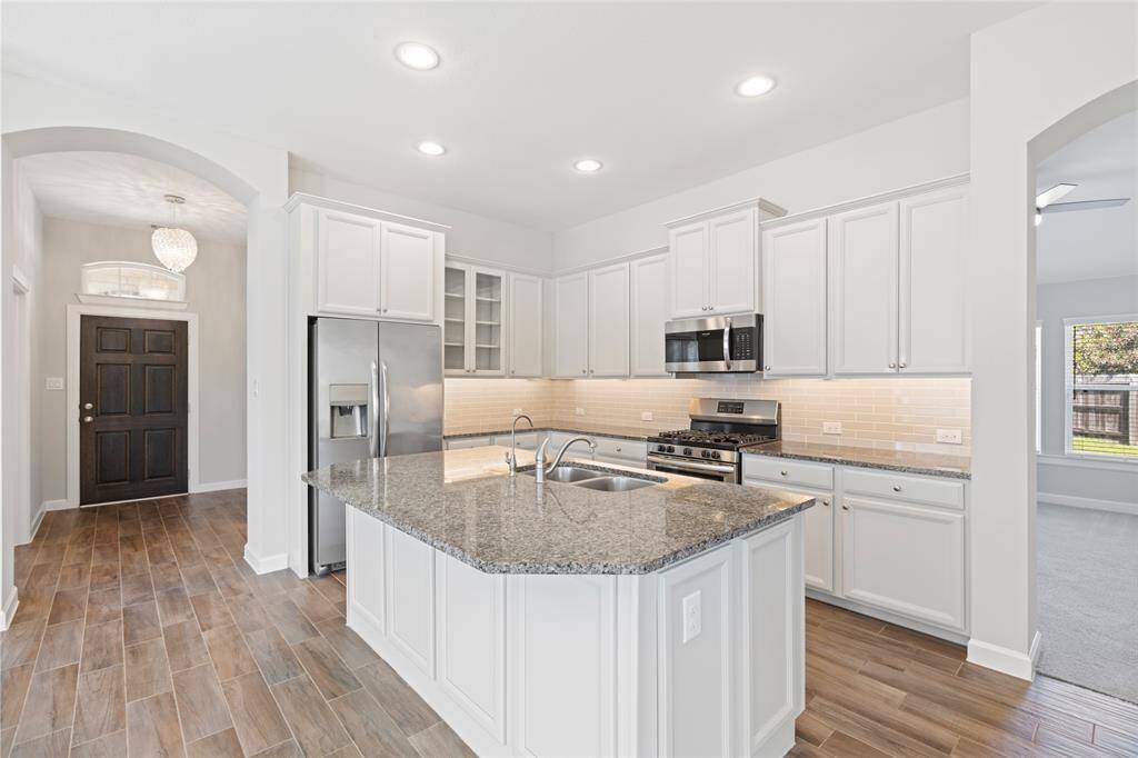 The heart of the home, where the oven is always preheated and the fridge is always mysteriously empty.