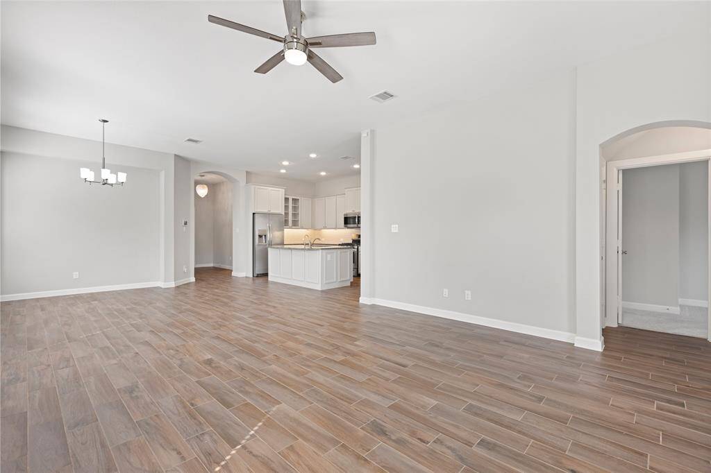 A space designed for socializing… or avoiding awkward conversations by just watching more TV.
