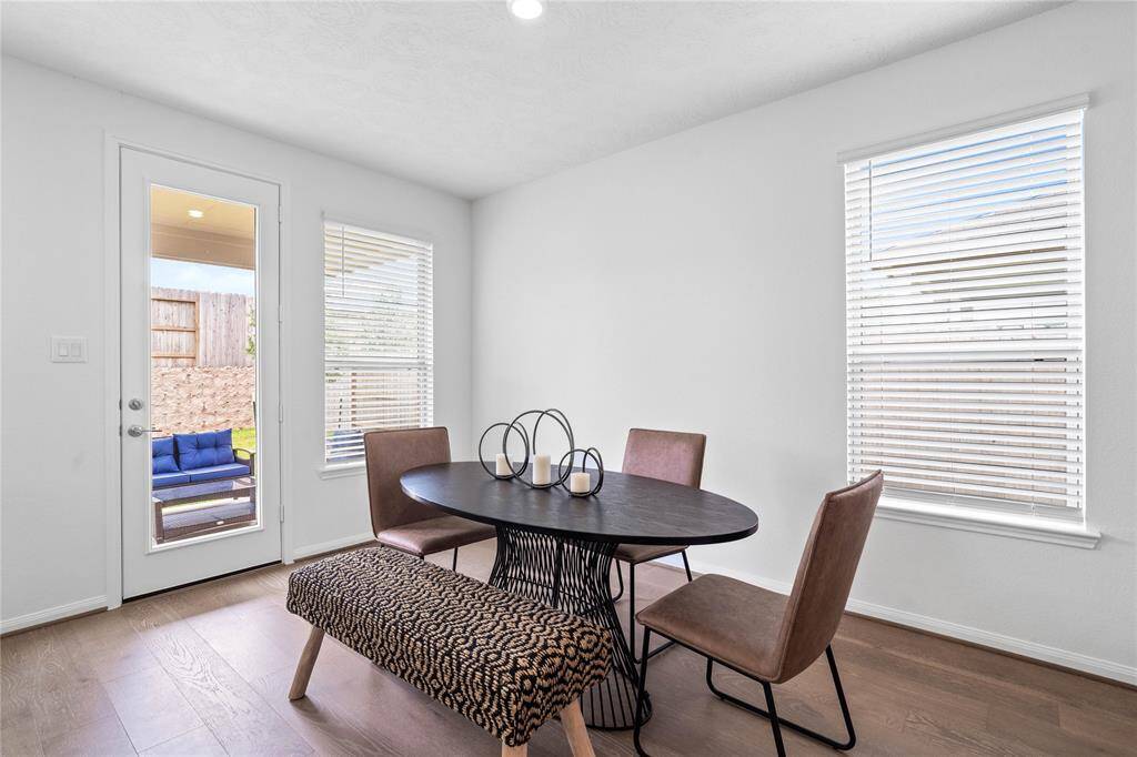 Make memories gathered around the table with your family and friends! This dining room features high ceilings, large window with privacy blinds, and easy access to your kitchen and family room.