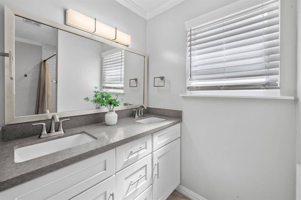 Bathroom number two featuring dual vanities.