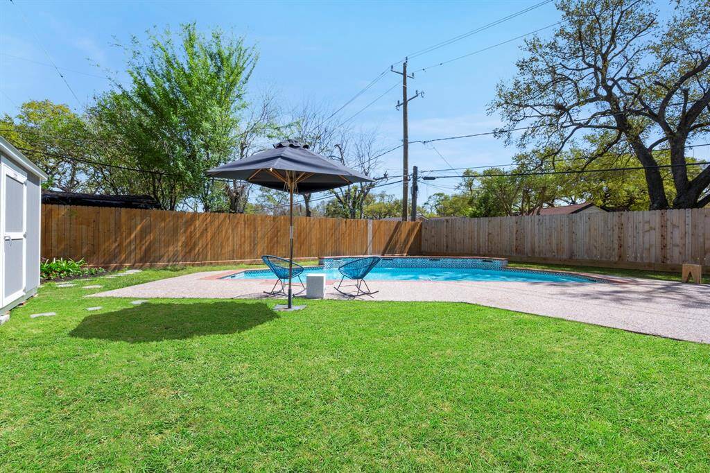 Your view of the backyard and pool when you step out of the primary suite.