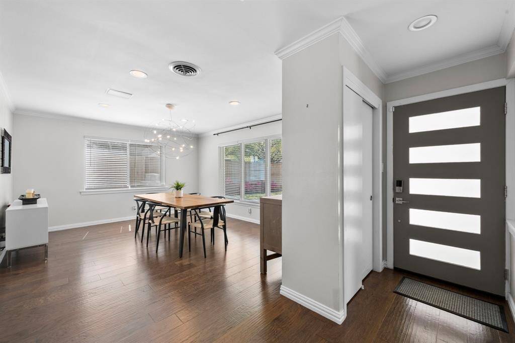 As you enter the home you are greeted by the open layout immediately to the right you will find the formal dining, where you and your guests will certainly dine in style! Featuring a large windows and wood flooring. Perfect space to entertain family and friends.