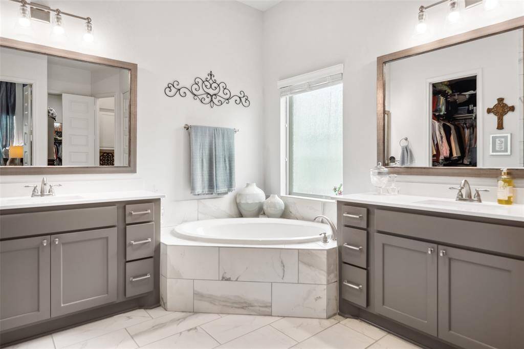 Primary bathroom has a 2 separate vanities