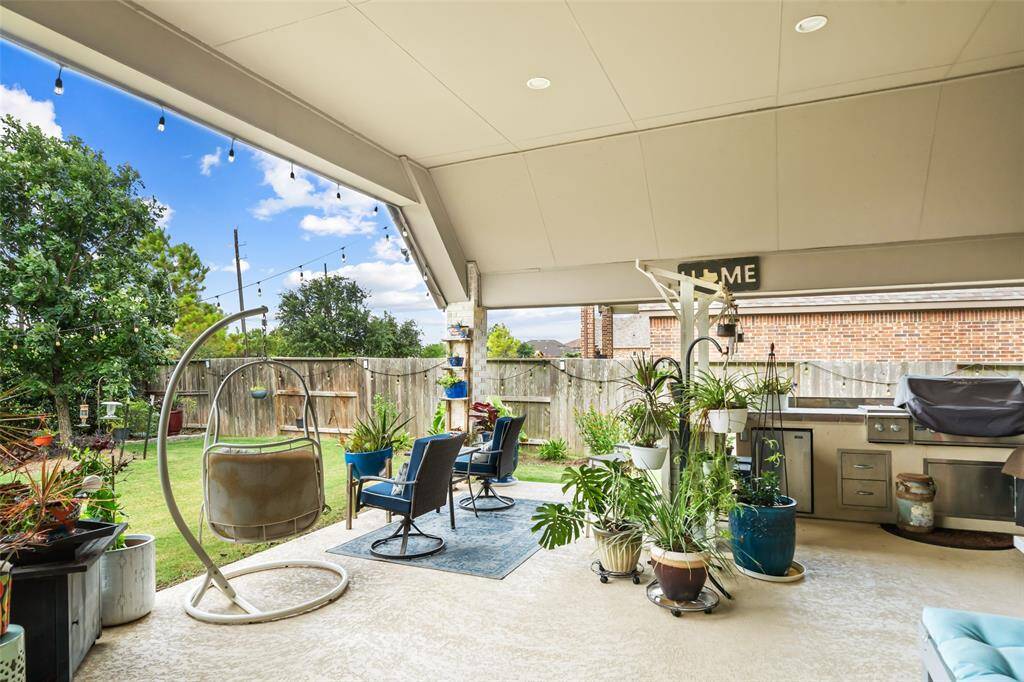 Extended patio and outdoor kitchen