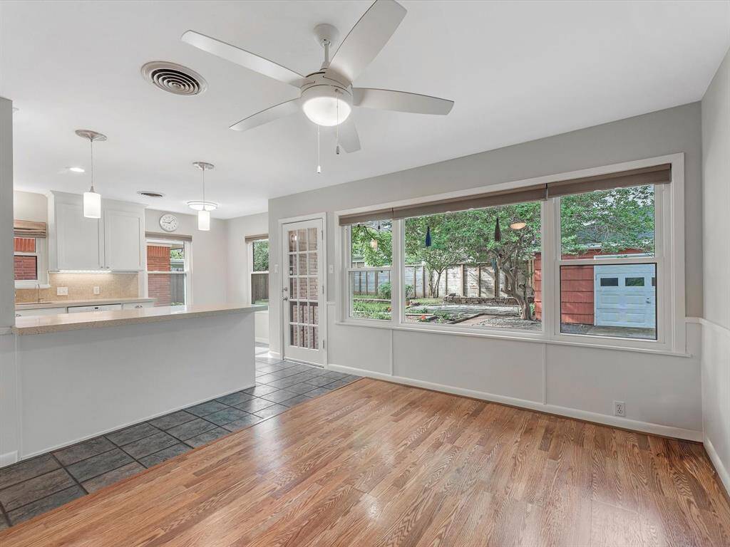 Bright kitchen seamlessly connects to the family room, offering stunning backyard views.