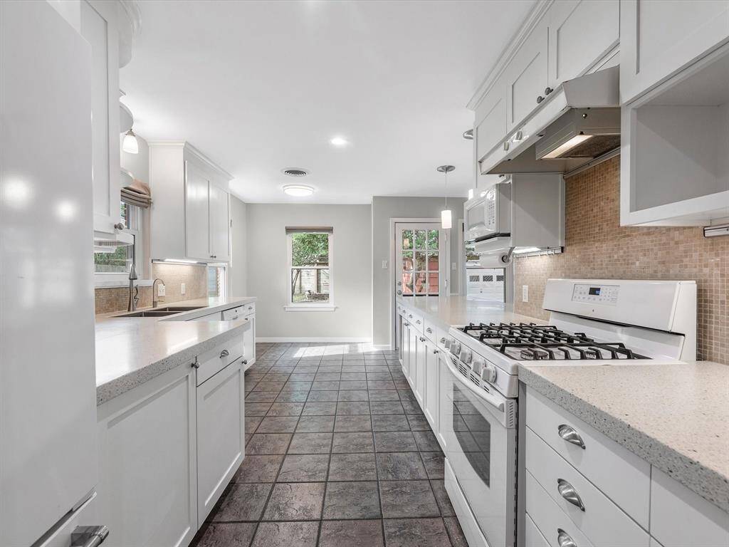 Inviting kitchen with a charming breakfast nook.