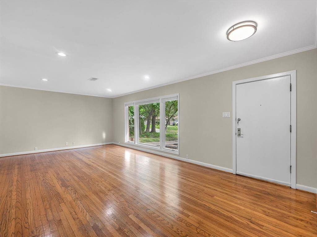 Experience timeless elegance with stunning original hardwood floors throughout the home.