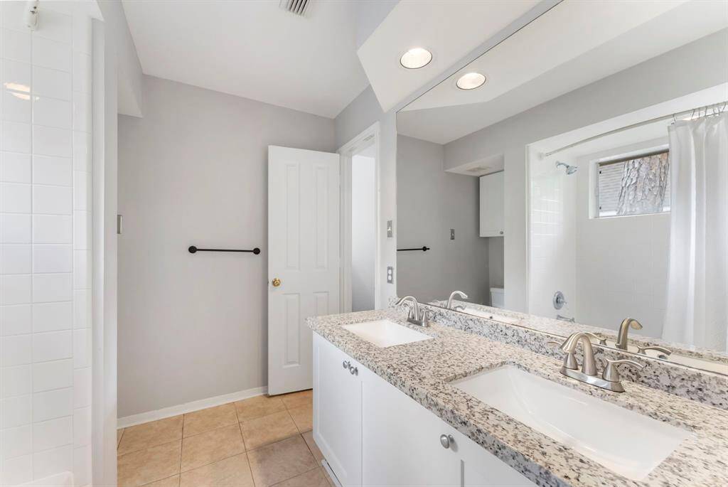 Two secondary bedrooms share a bathroom.
