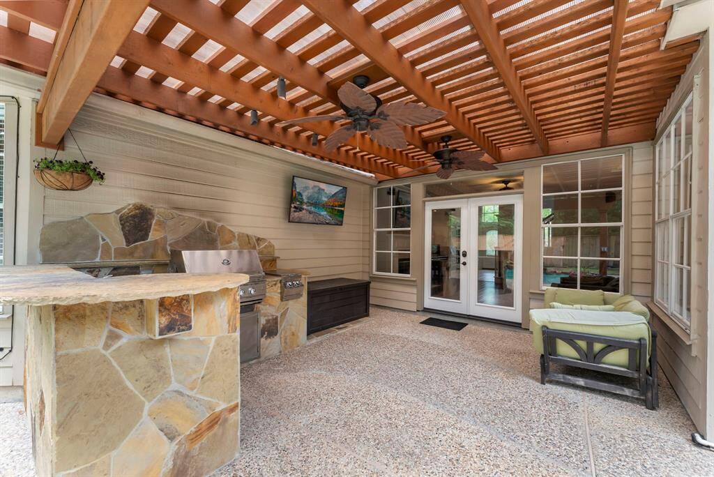 The summer kitchen and covered back patio are accessible through the family room.