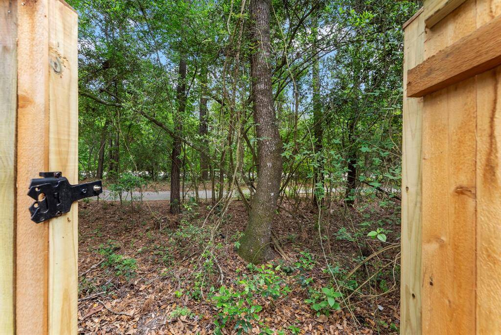 There is a door in the back fence to access the walking trails.