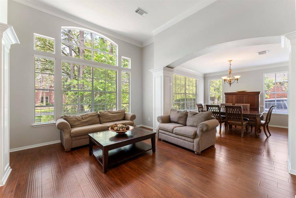 Hardwood flooring throughout the formal living room and formal dining room.