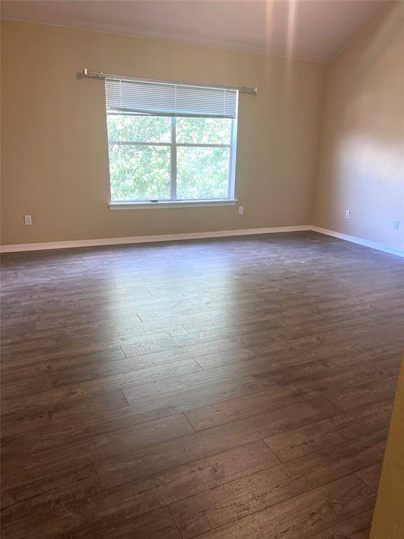 hand scraped wood laminate all over the house . Easy to maintain ,