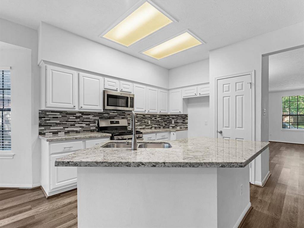 Great Kitchen Island & All Stainless Steel Appliances