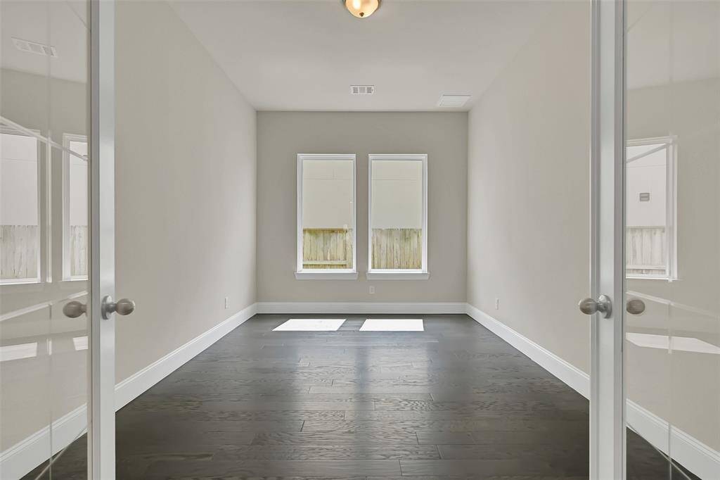 Great Home Office Space with Cut Glass Doors Between This Space and the Living Area for Auditory Privacy! Please Note the Excellent Natural Light Through Large Windows!