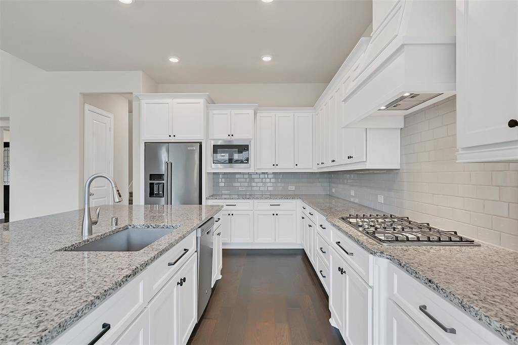 Check Out This Stellar Kitchen Layout! Five Burner Gas Stove and Double Ovens with a Sink Large Enough for Larger Pots and Pans! All Upgraded Stainless Steel Appliances Come with This Amazing Home!