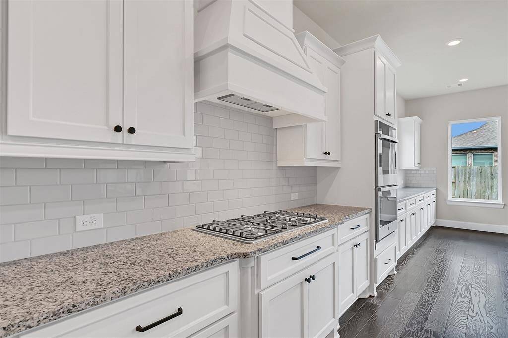 Another View of the Kitchen Looking into the Breakfast Room with All of the Upgraded Cabinetry by J-Kraft Custom Cabinets - a Special Upgrade Feature for All of Your Party Goods!