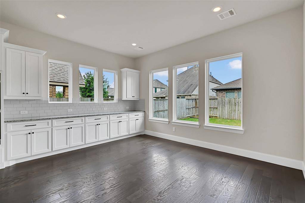 Everyone's Favorite Upgrade Must Include All of This Extra High-End Cabinetry and Counter Space! The Perfect Place for Hosting Massive Buffets or Parties! No Small Breakfast Table Needed Here - There is Space for Whatever Sized Table or Configuration You Need!