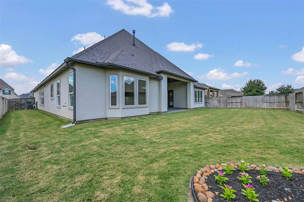 A Nicely Sized Back Yard with Just Enough Space to Play and Party without a Large, High Maintenance Lifestyle!
