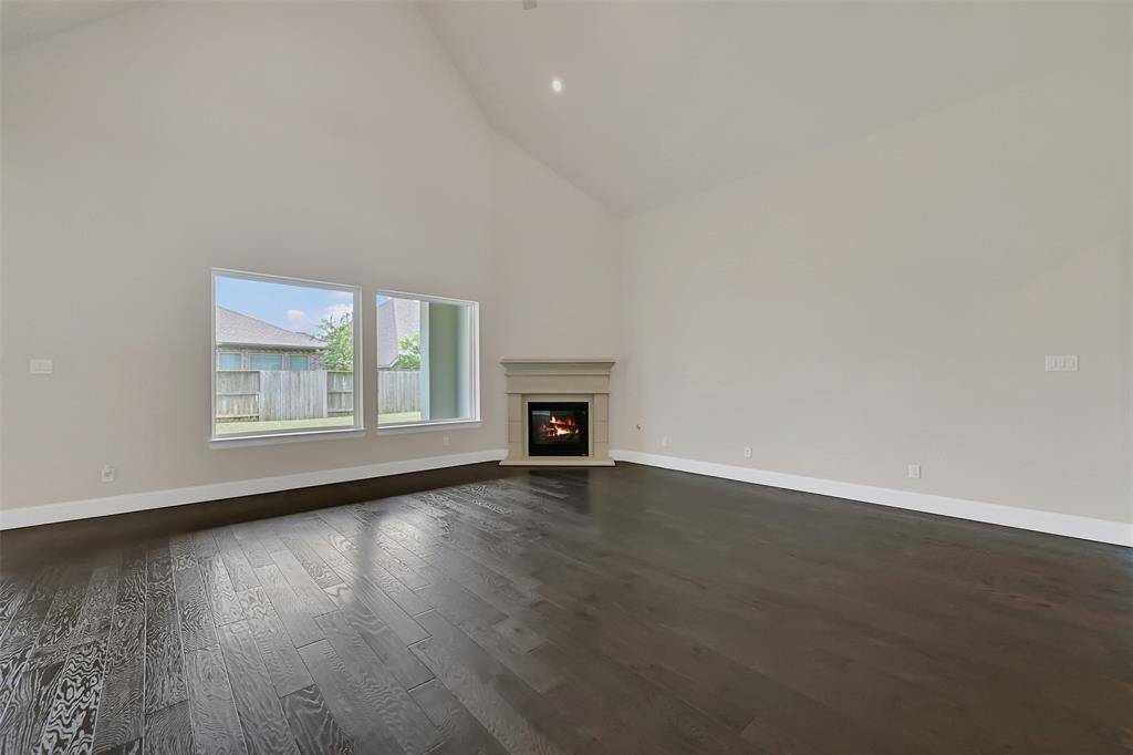 So Much Space to Arrange Large Furniture in Numerous Configurations! This High End Engineered Wood Flooring is Throughout the Home! Soaring Ceilings Make the Main Living Areas Feel So Grand!