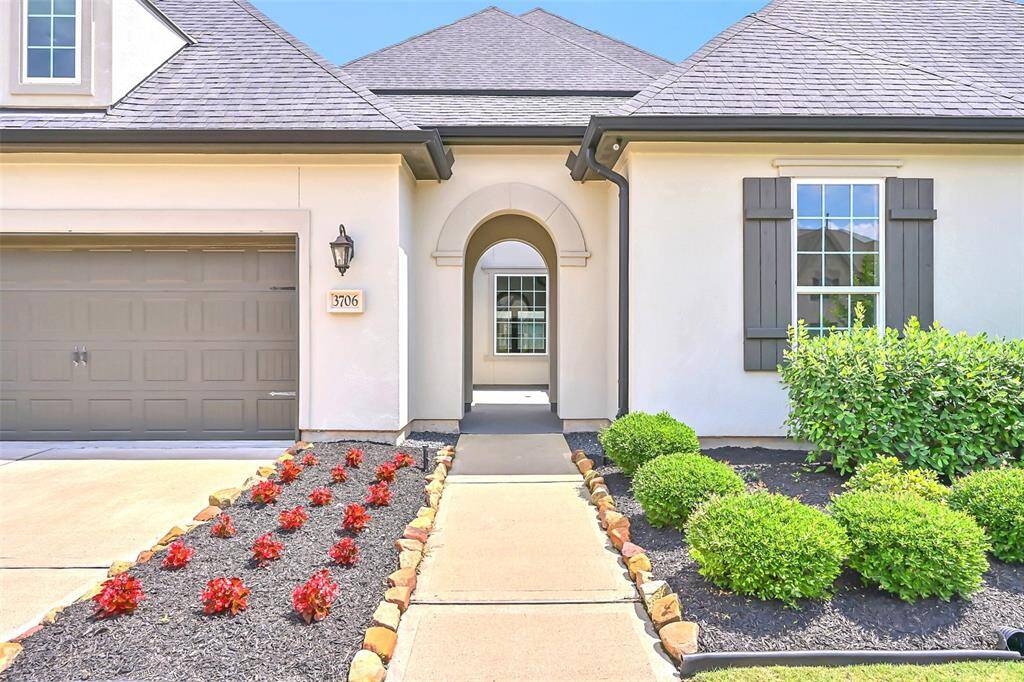 Lovely Arched Entryway Leads to a Private and Easily Secured Courtyard for Additional Privacy and Security! Low Maintenance Landscaping Ensures Your Home has Perfect Curb Appeal Every Day.