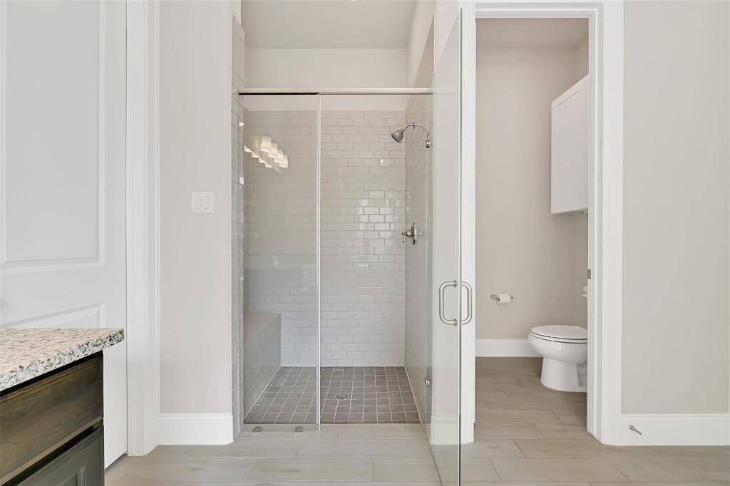 In Addition to the Sumptuous Garden Tub, There is a Separate Shower Area Across the Primary Bathroom! With a Neutral Design Palette, This Home is Move-In Ready for All of Your Personal Design Elements Without the Need to Repaint a Thing!