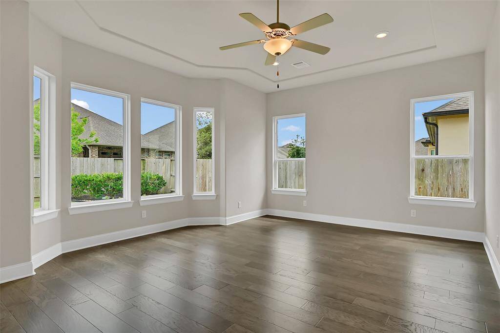Gorgeous and Spacious Primary Bedroom has a Bay Window Bump-Out for the Sensation of Even More Space! A Clean Line Recessed Tray Ceiling Complements that Design Element!
