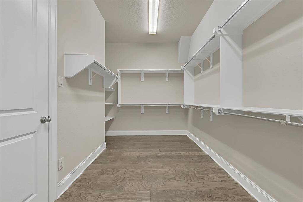 Welcome Fashionistas! THE Primary Bedroom Closet You Have Been Dreaming Of! The Perfect Opportunity to Organize and Showcase All of Your Pretty Things!