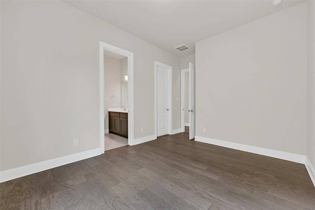 This Photo Depicts the Doors to the Closet and En-Suite Guest Bathroom for the Smaller, Secondary Primary or Guest Bedroom!
