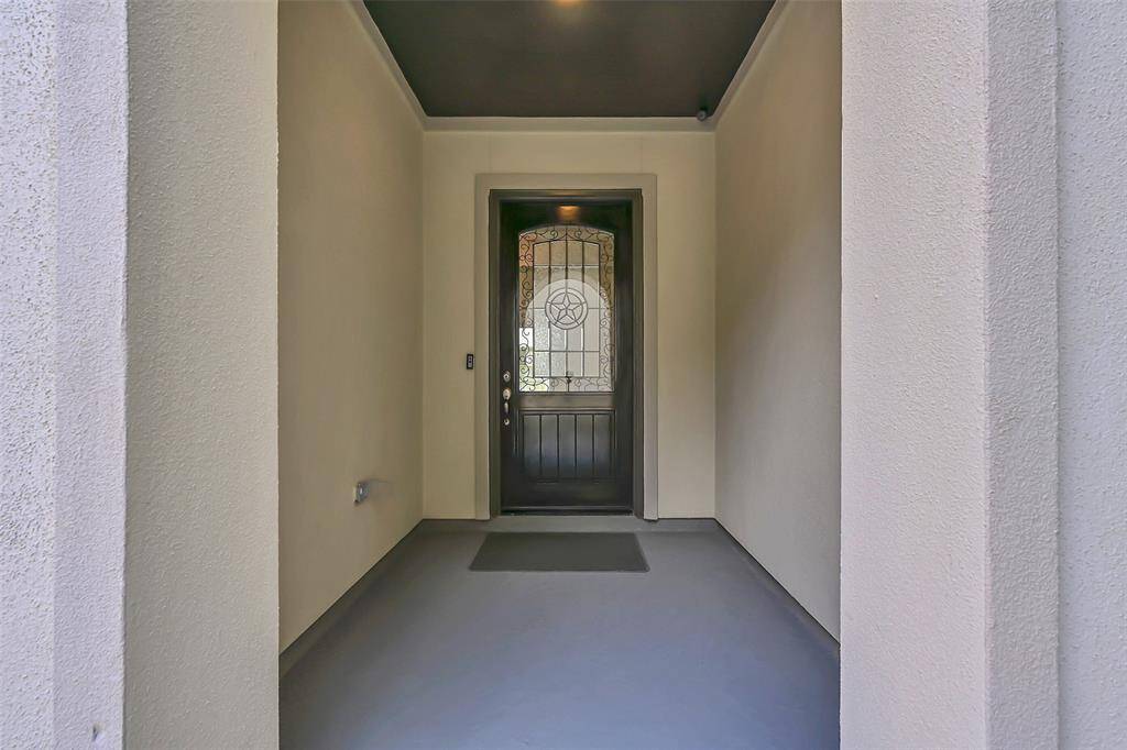 Arriving From the Private Courtyard, a Very Large Covered Entry Allows Your Tasteful Decor to Personalize Your Front Door and Entry Area for a Stunning Effect!