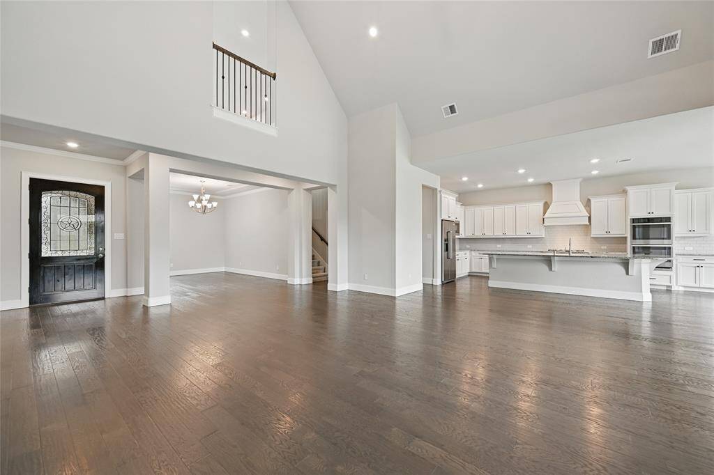 Note the Enormous Rooms with Flexible Design Potential for Real-Sized Furnishings and Luxurious Living! Looking Past the Entry, Towards the Formal Dining Area, You Realize the Living Room Doesn't Have to Share Space with All of Your Dining Room Furniture. No Compromises are Needed in this Shea Designed Home - with Space for Everything!