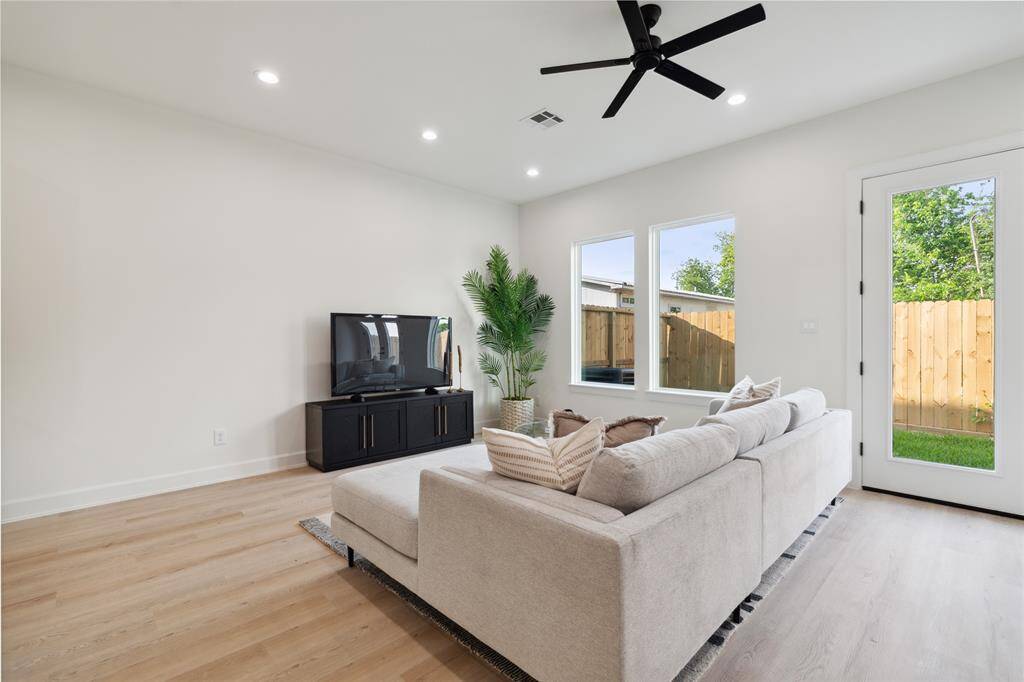 Natural light streams through expansive windows, bathing every corner of this inviting home in a serene glow from dawn till dusk. Experience tranquility and warmth in every room.