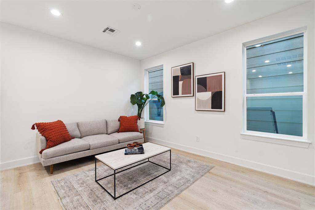 This secondary living area effectively separates the primary and secondary bedrooms, balancing privacy and functionality. It creates distinct living zones while maintaining a cohesive and comfortable environment.
