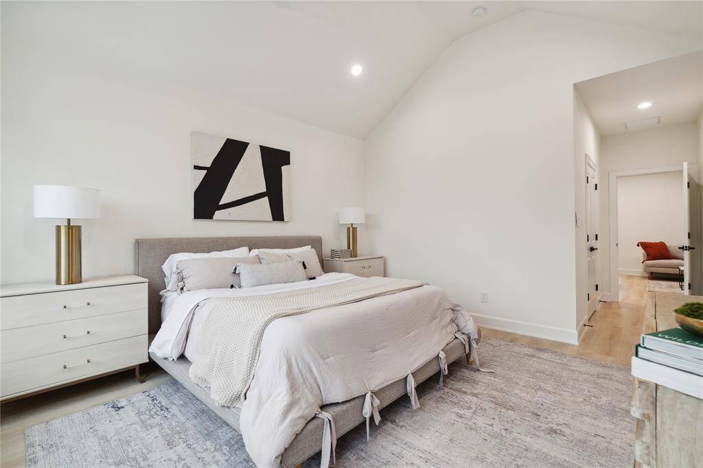 Relax in the primary bedroom, featuring a private ensuite with elegant finishes and plenty of natural light.