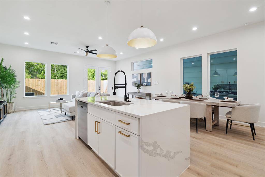 Windows thoughtfully placed around the living area flood the space with natural light, enhancing the open and airy atmosphere