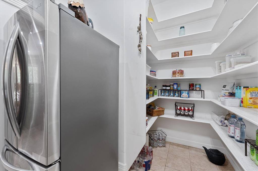 Huge wrap around pantry can hold an additional full size refrigerator