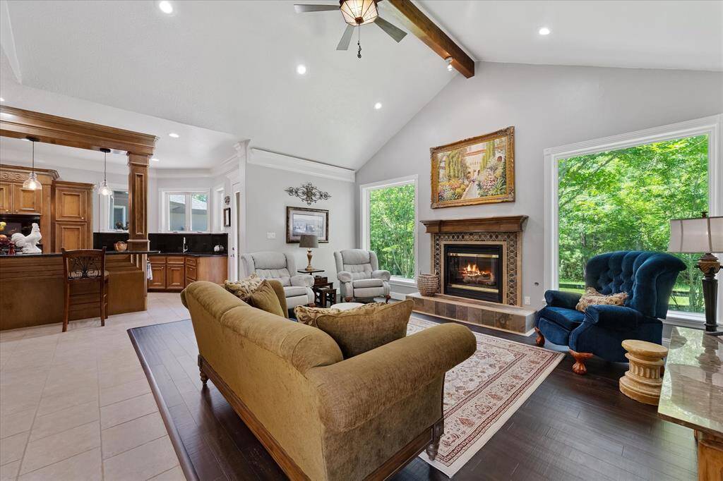 Family room off kitchen with fireplace and HUGE picture windows!