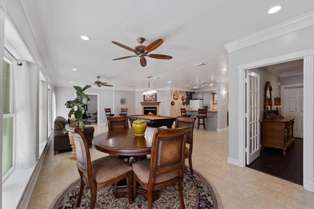 Game room has 2 sets of French doors leading outside from the walkout basement to patio area