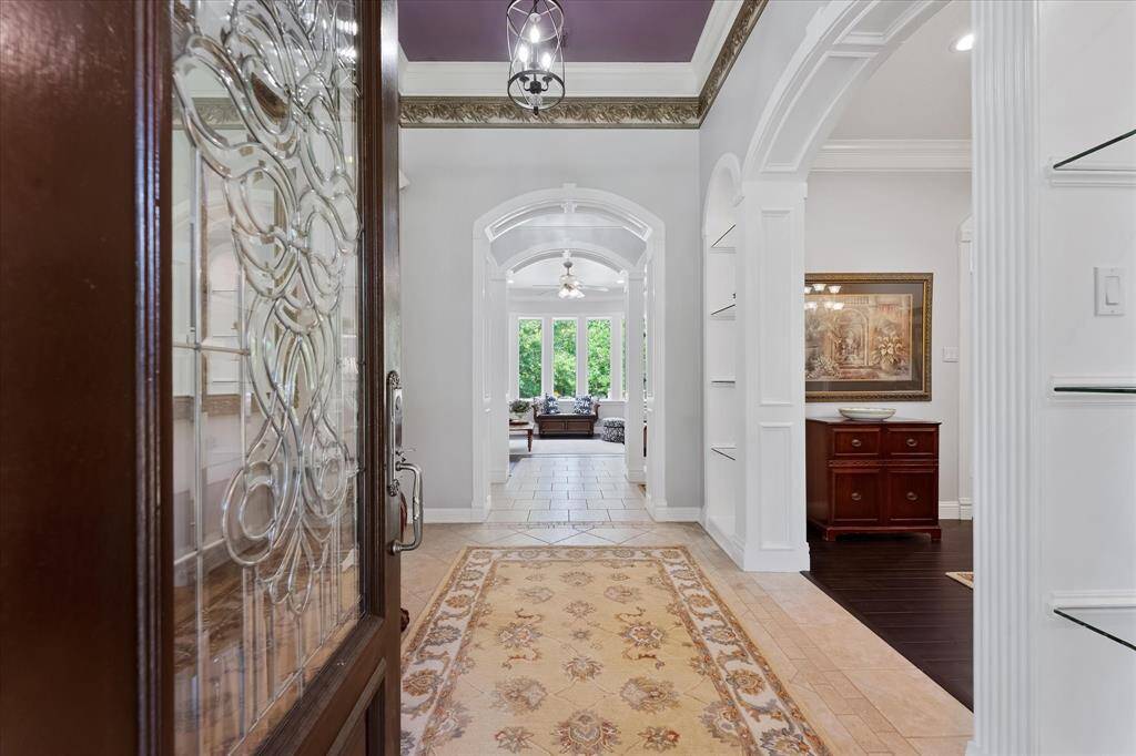 Enter on main floor from garage and exterior! floorplan online will give you a great view of the layout! Custom moldings throughout! This home was truely built on site with all the cabinetry and wood work!