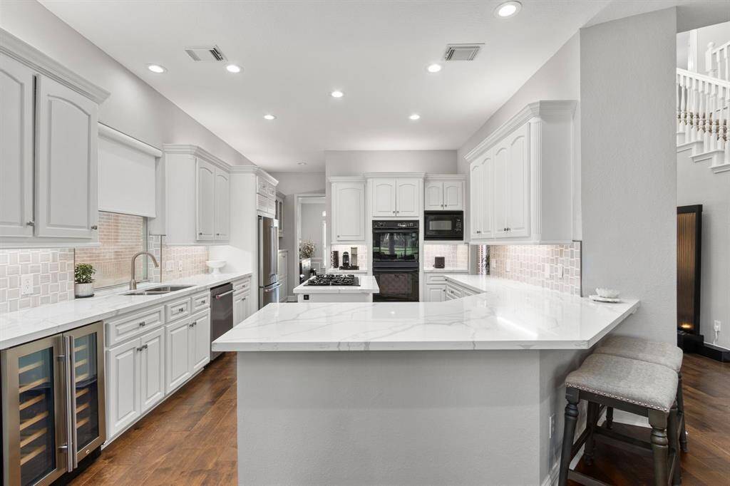 Another look at the pristine kitchen. Note the new undercounter wine refrigerator on the left!