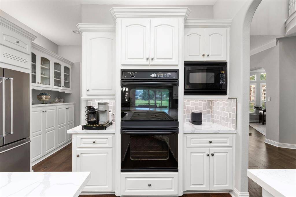 A look from the kitchen into the butler's pantry. This home's layout is perfect for hosting gatherings both large and small.