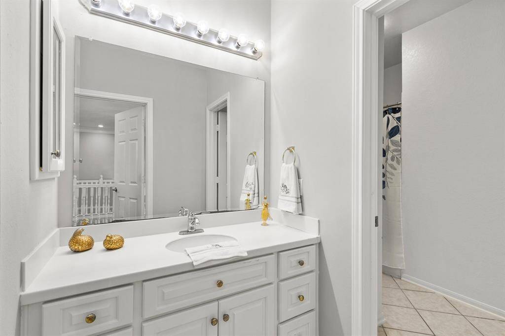 This pretty bath has private access to the bedroom but can also be used by gameroom.