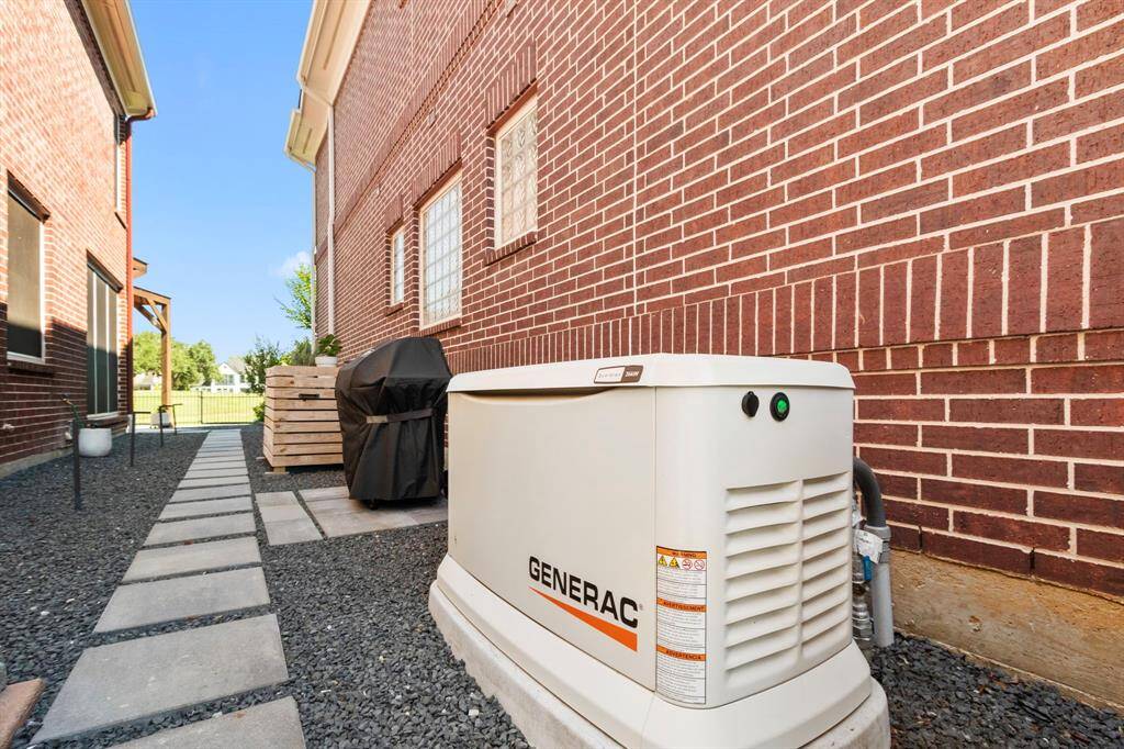 Generac generator (26K) installed in 2024 is located on the side yard.