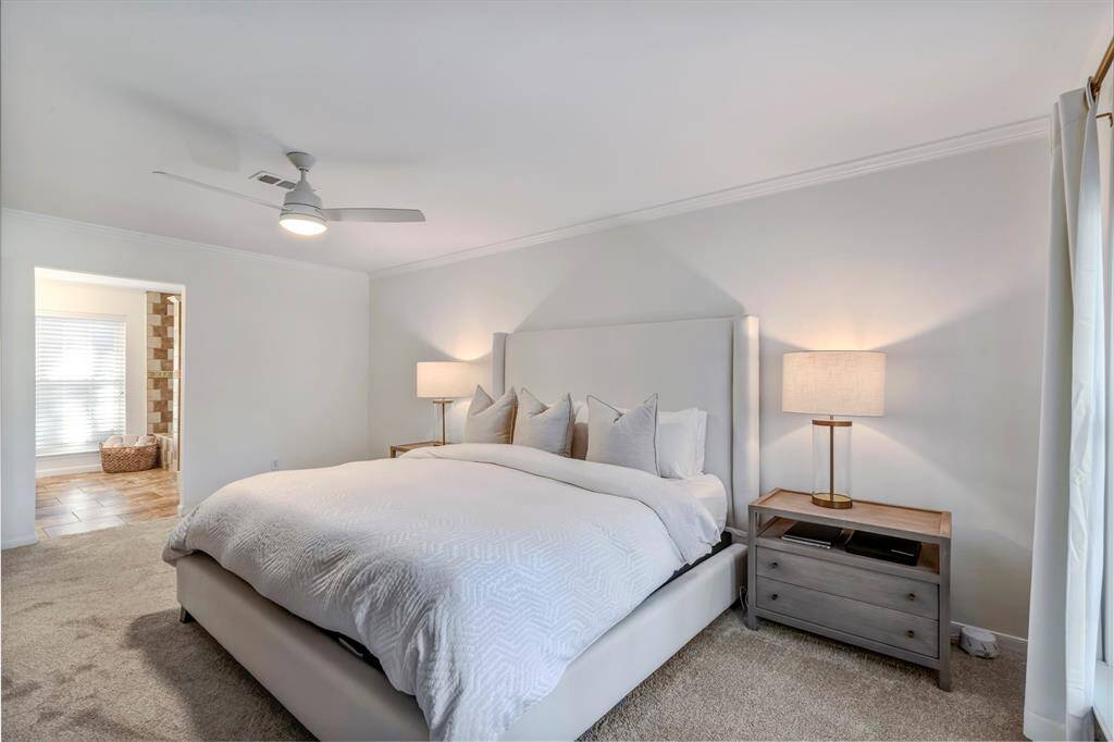 Primary bedroom with ensuite bathroom and double vanities